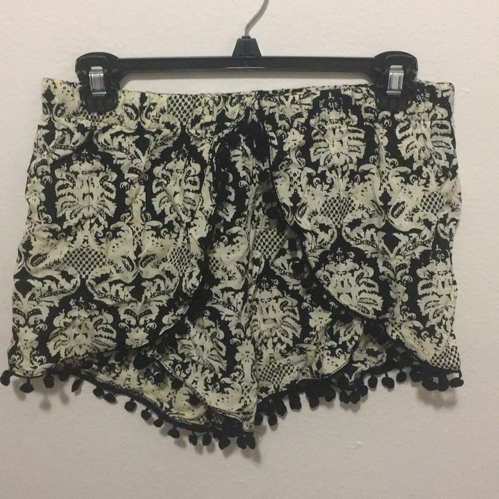Fun and flirty shorts with cute pom poms!